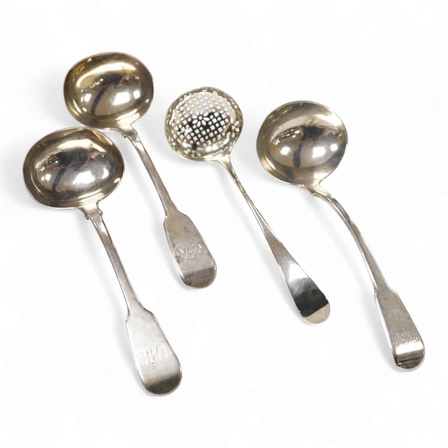 A pair of George IV silver fiddle pattern sauce ladles, by Charles Eley, London, 1826, 17cm, together with a George III silver fiddle pattern sauce ladle, London, 1806 and a George III silver Old English pattern sifter l